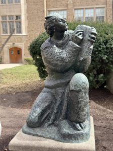 A bronze sculpture by Ivan Meštrović outside a campus building at Notre Dame.